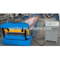 Steel deck floor forming machine